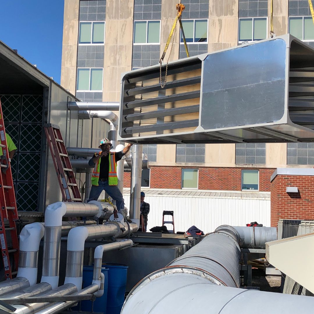 Lifting air blending system into place