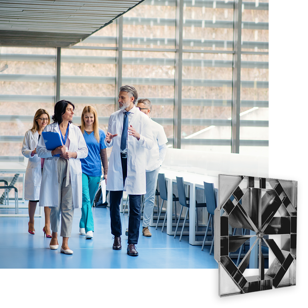 photo of doctors walking though open hospital corridor